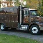 A semi-truck used for compactor maintenance from B-P Trucking, Inc. in Ashland, MA