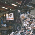 Packer Truck Dumping Load