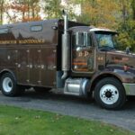 A semi-truck used for compactor maintenance from B-P Trucking, Inc. in Ashland, MA
