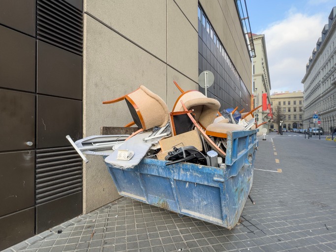A dumpster filled with office chairs during the scheduled cleanup in the Greater Boston Area.